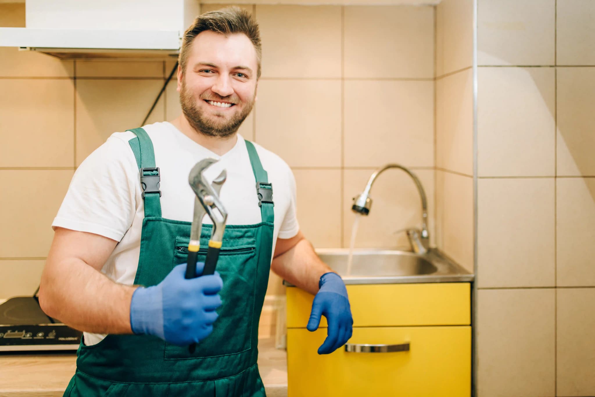 plumber-in-uniform-holds-wrench-handyman-for-plumbing